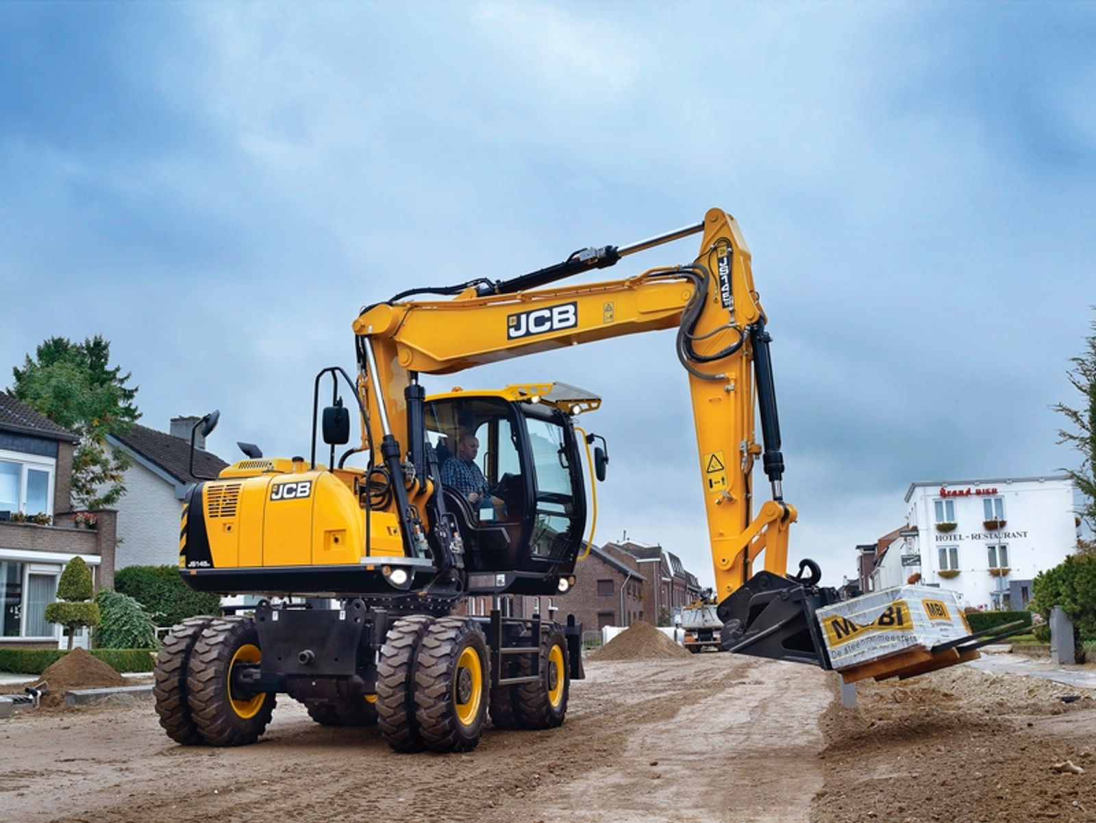 JCB graafmachine aan het werk