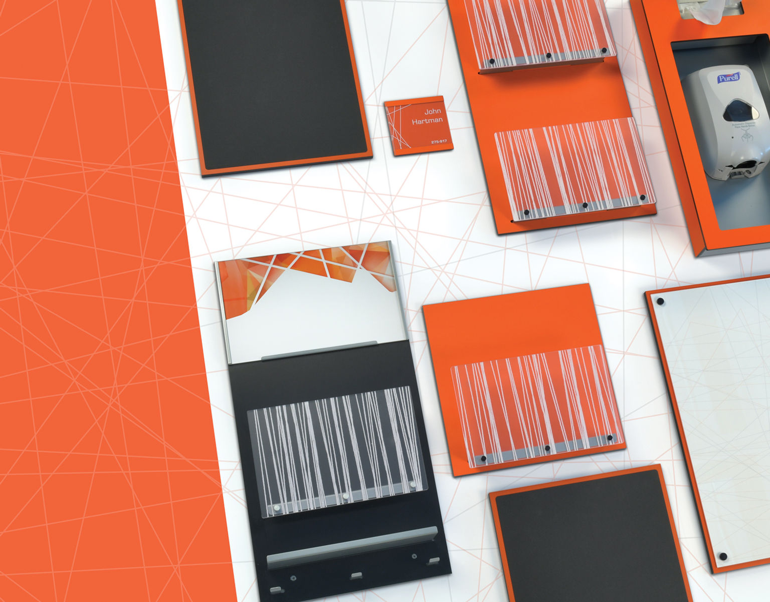 A wall accessory system design with a diagonal geometric pattern and bold orange finishes. Elements include wall organizers, message boards, sanitizer stations, and workstation nameplate