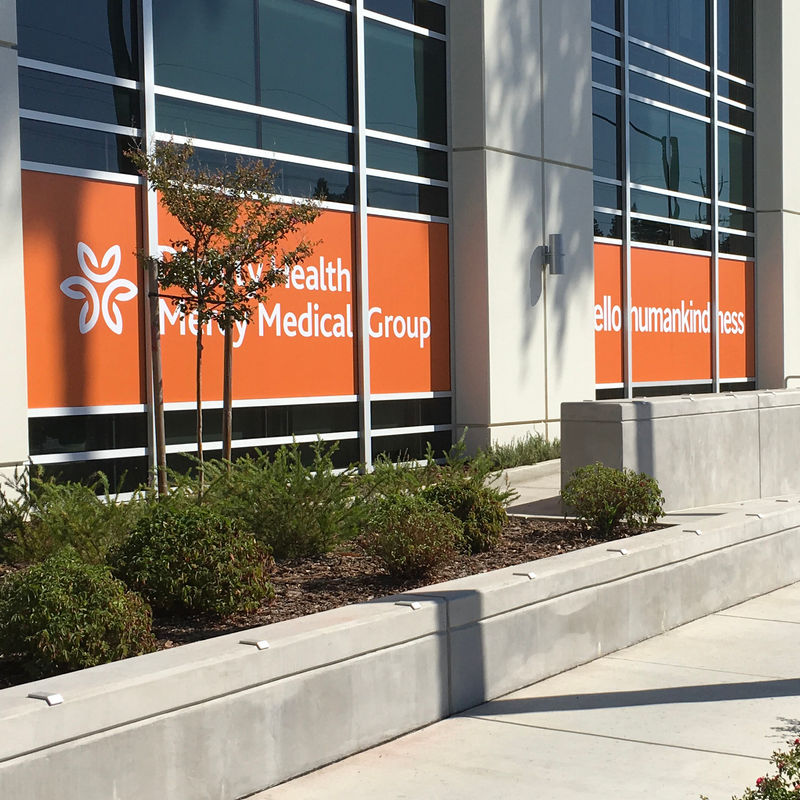 Exterior window film application brings hospitals brand presence to the surrounding campus.
