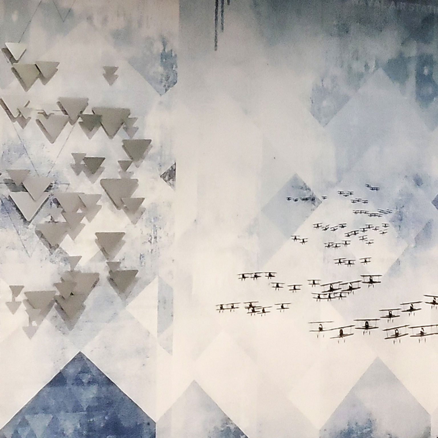 Close-up detail of custom paste-up wallcovering featuring a historic image of U.S. Navy biplanes flying in formation.