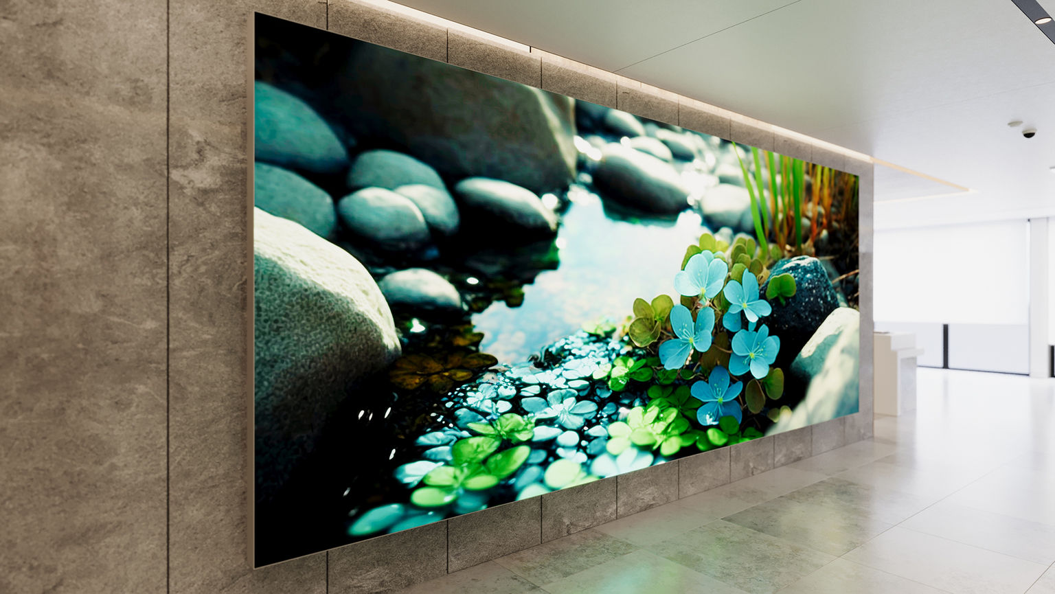 A large scale illuminated silicone edge graphic art installation in a hospital lobby featuring a calming nature scene.