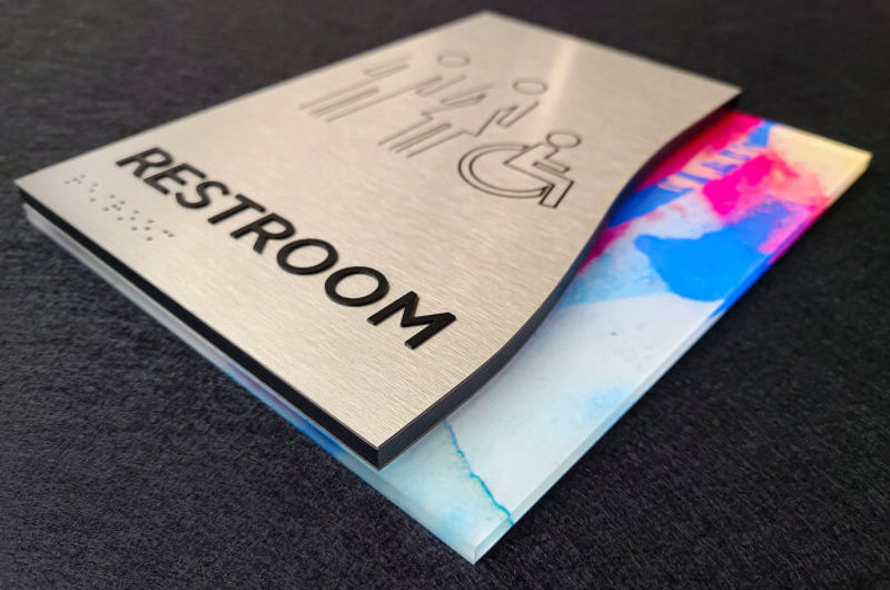 Fusion ADA compliant interior Restroom signage with Formica face and direct print Vivid backer