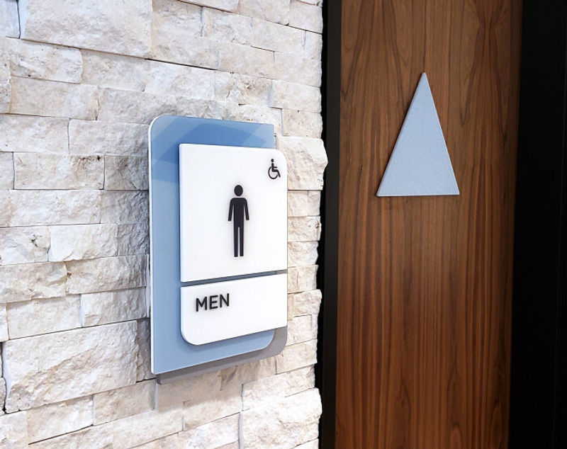 Vivid multi layer ADA compliant Restroom ID signage done for a Healthcare Facility