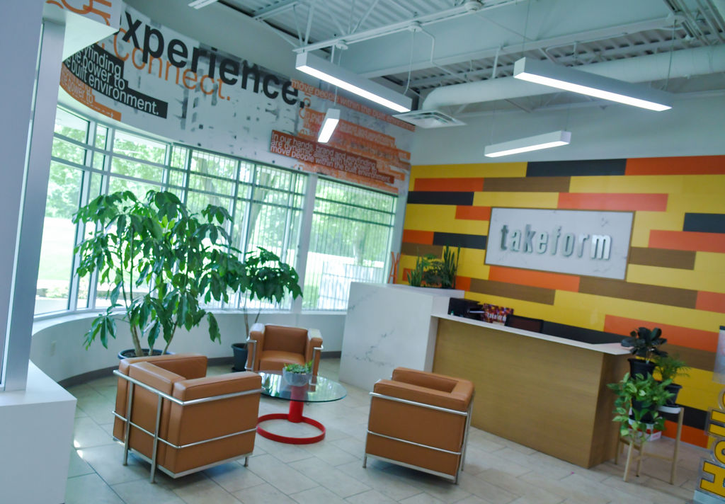 Takeform reception area filled with custom branded experiential graphics.