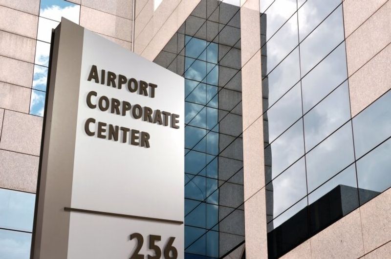 Signify Exterior Oblique Cabinet Signage Airport Corporate Center