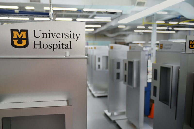 Fusion Brushed Aluminum Freestanding Kiosk with Purify Sanitizer & Tissue Holder attached to the face done for The University of Missouri.