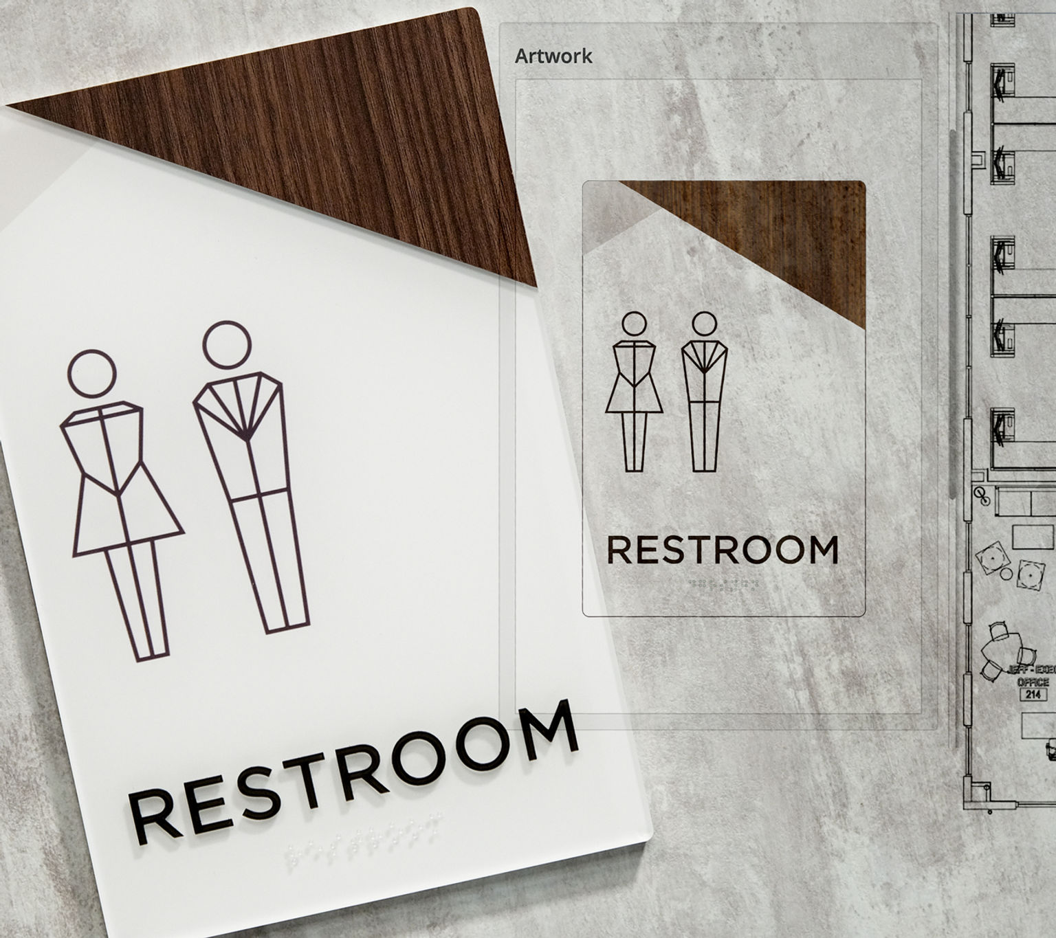 A custom restroom sign design with contemporary linear pictograms and dark wood accent contrasted against a clean white finish, pictured with a designer's rendering of the sign and the location plan of the sign's destination.