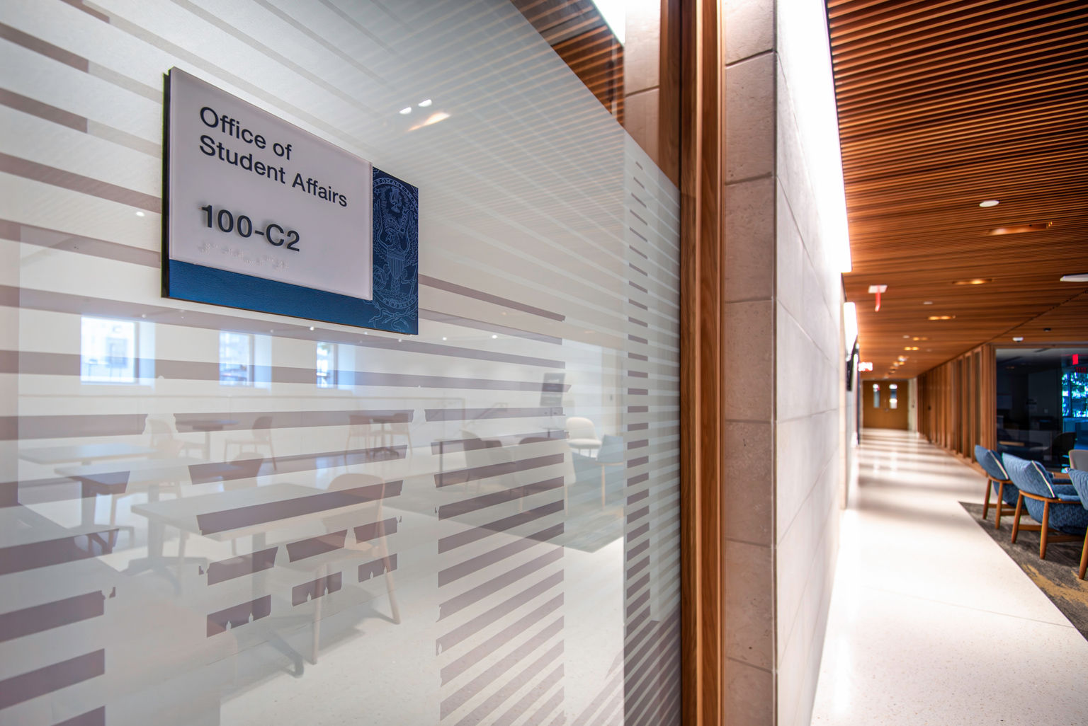 Custom branded interior room ID sign applied to glass surface