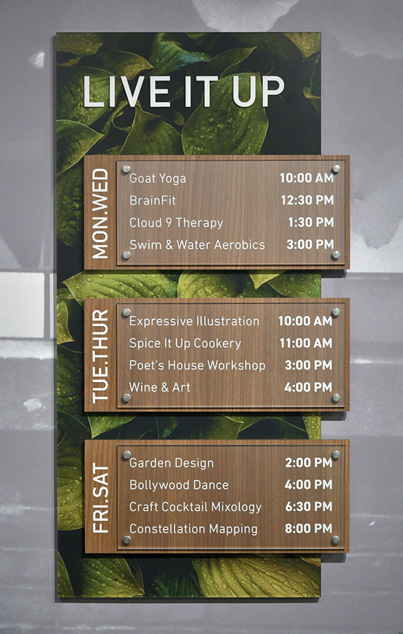 Designed for a Loft-style Senior Living facility, this Fusion-based event-schedule sign celebrates the beauty of life through floral images complemented by InteriorArts 3102-VNR Rancho Walnut laminate.