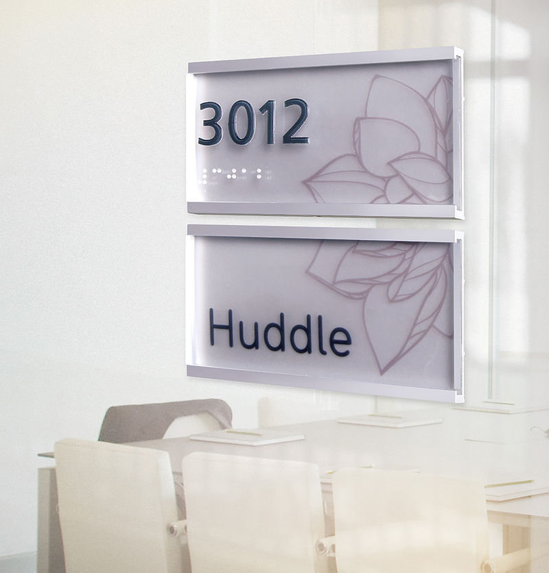 Contemporary two-piece glass-mounted anodized aluminum ADA room identification sign featuring custom plant graphic spanning across the sign components