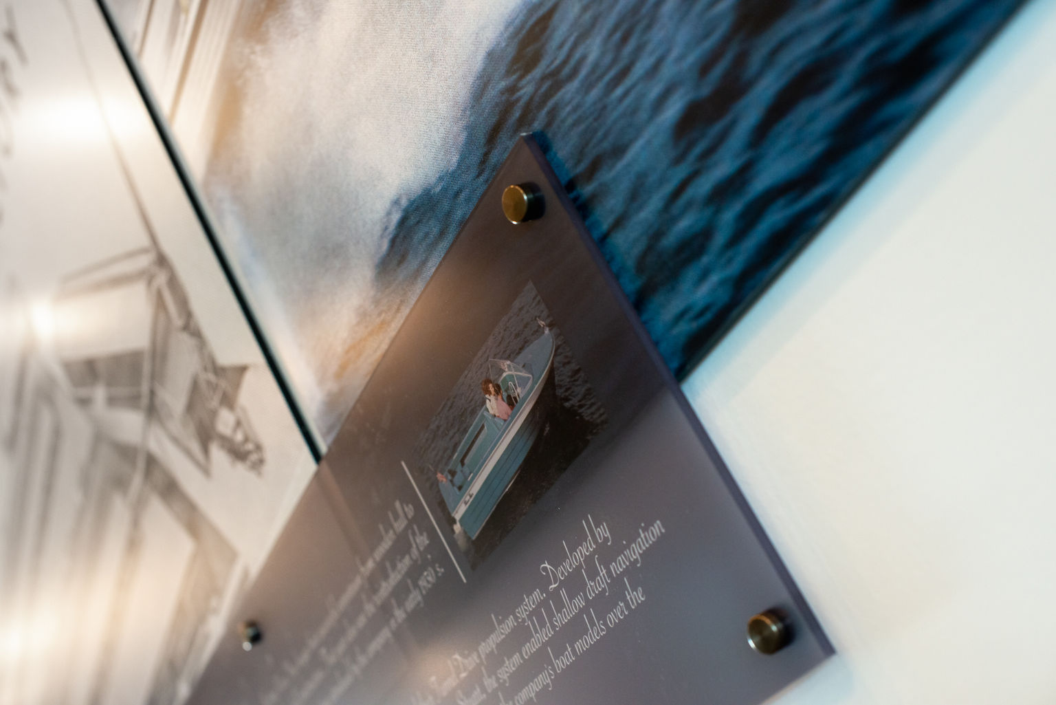 A detail photo of multiple graphic panels secured with decorative button mounts.