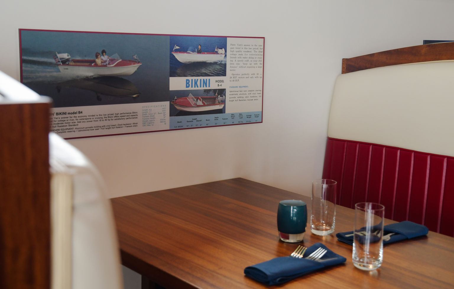 Custom designed booth sitting area of boating graphics and upholstery.