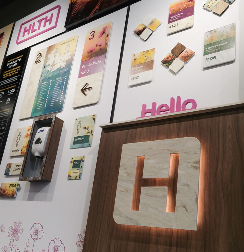 Interior signage, brand standards and a backlit logo constricted with Corian and Vivid products.