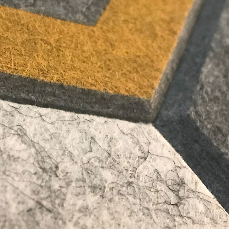 Close-up detail of the beveled edges on custom-printed wall tiles
