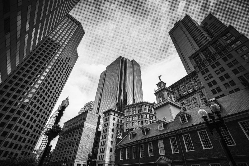 Black and white photo of downtown Boston architecture with a halftone graphic applied.