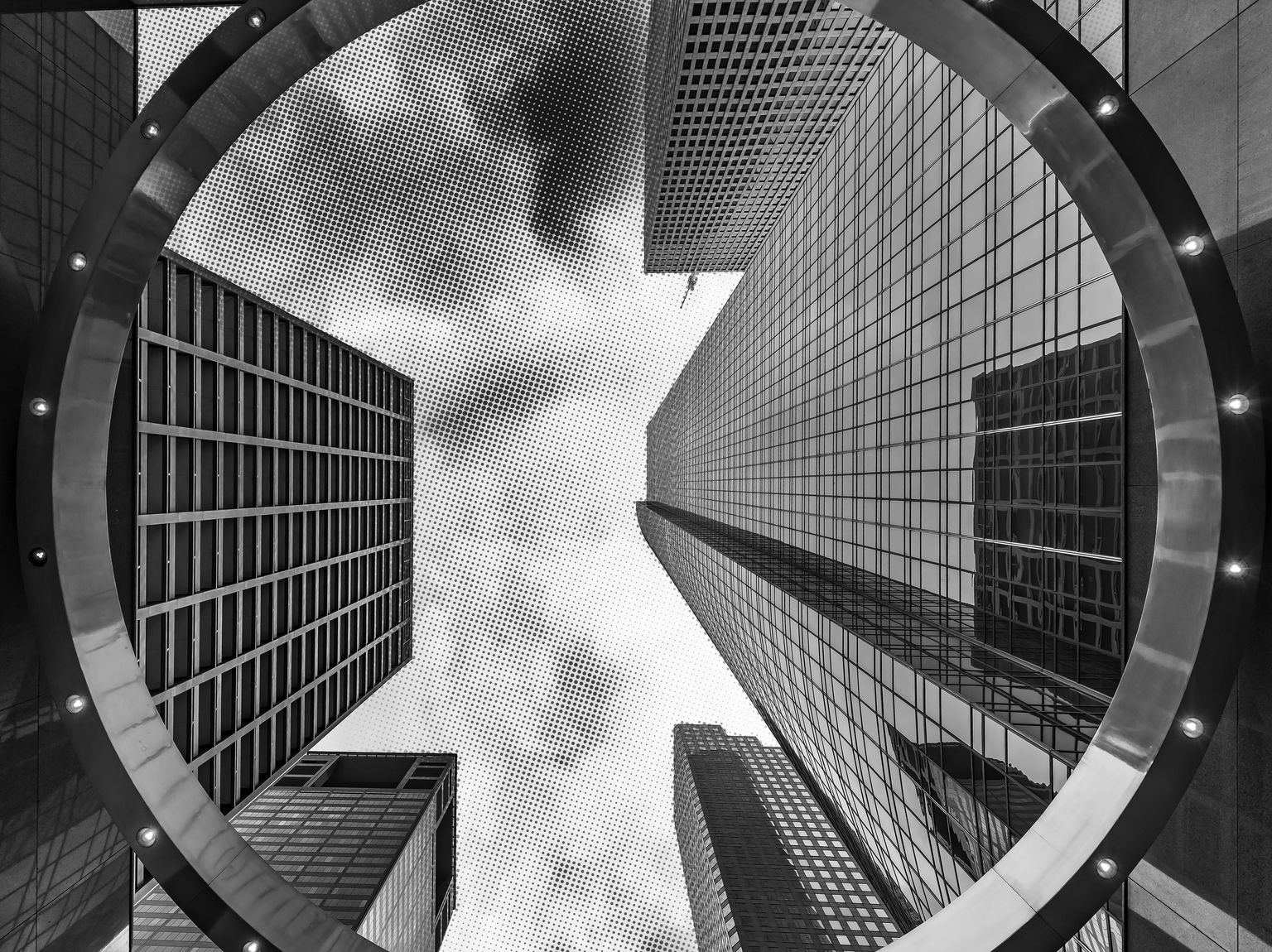 Black and white photo of downtown Houston architecture with a halftone graphic applied.