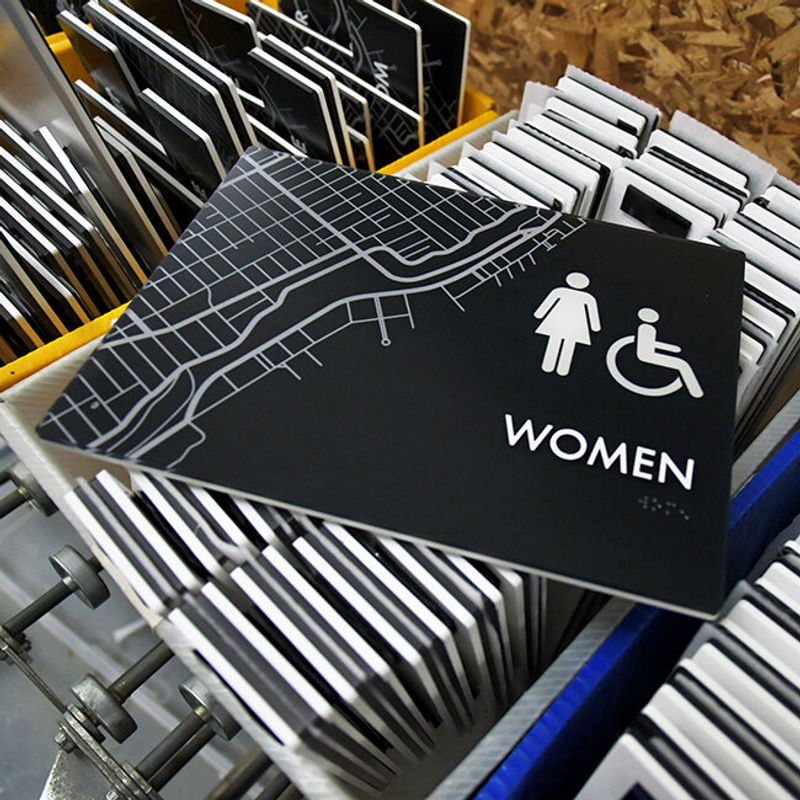 Vivid ADA compliant interior Women's Restroom sign