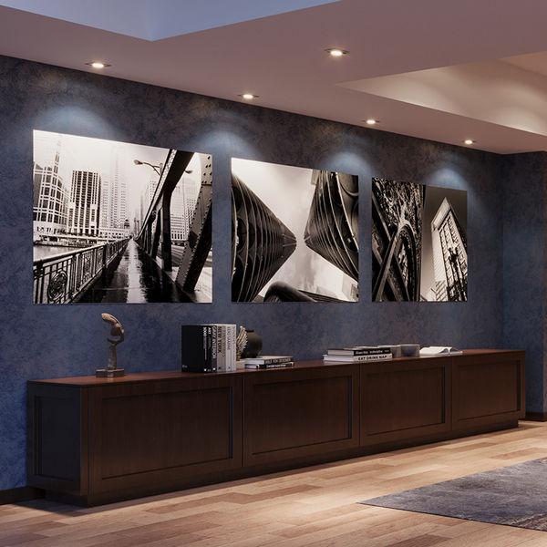 A contemporary lobby space featuring art installations of black and white photos of Chicago.