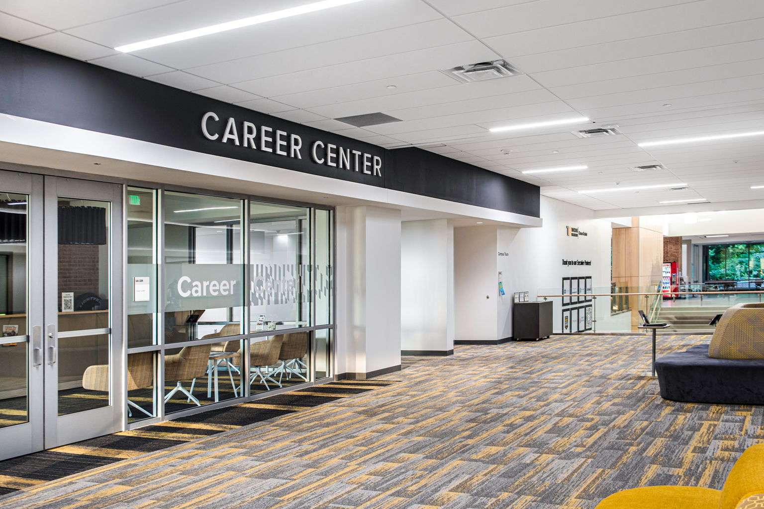 The outside of a college career center branded with privacy window film, dimensional letters and interior signage.