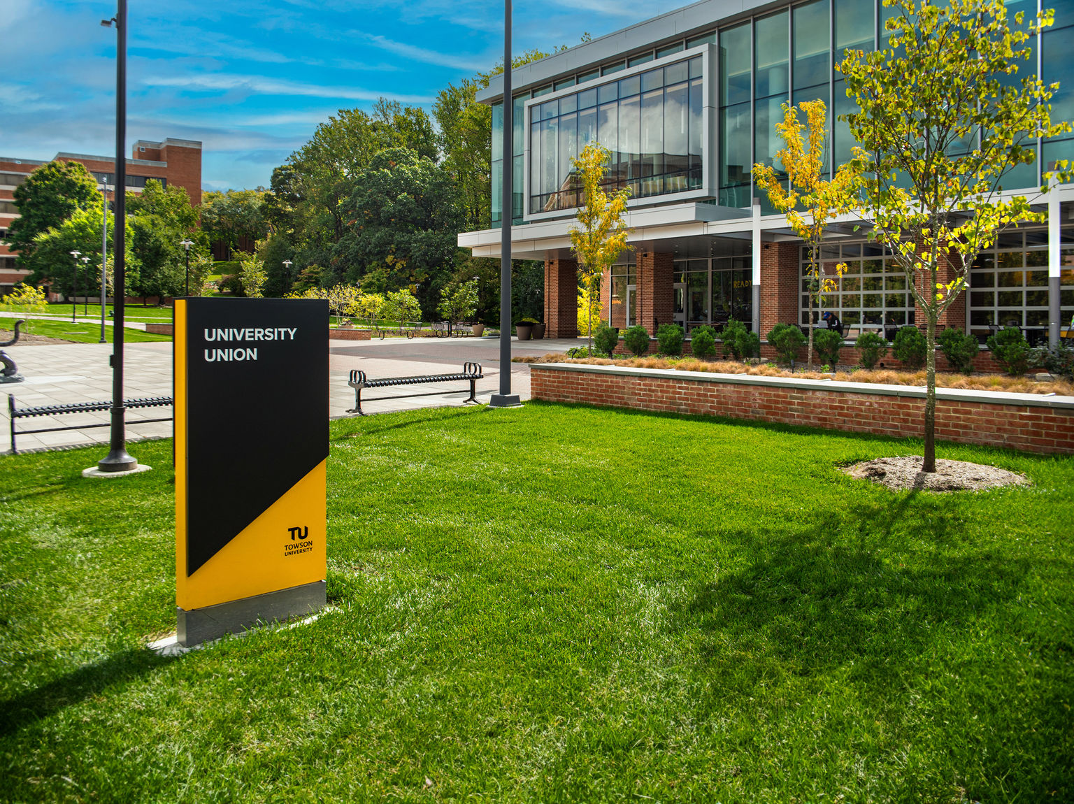 An exterior building ID monument sign installed outside a university union