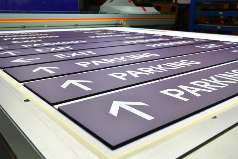 Transit Parking Garage directional signage getting printed on our flatbed printer. 