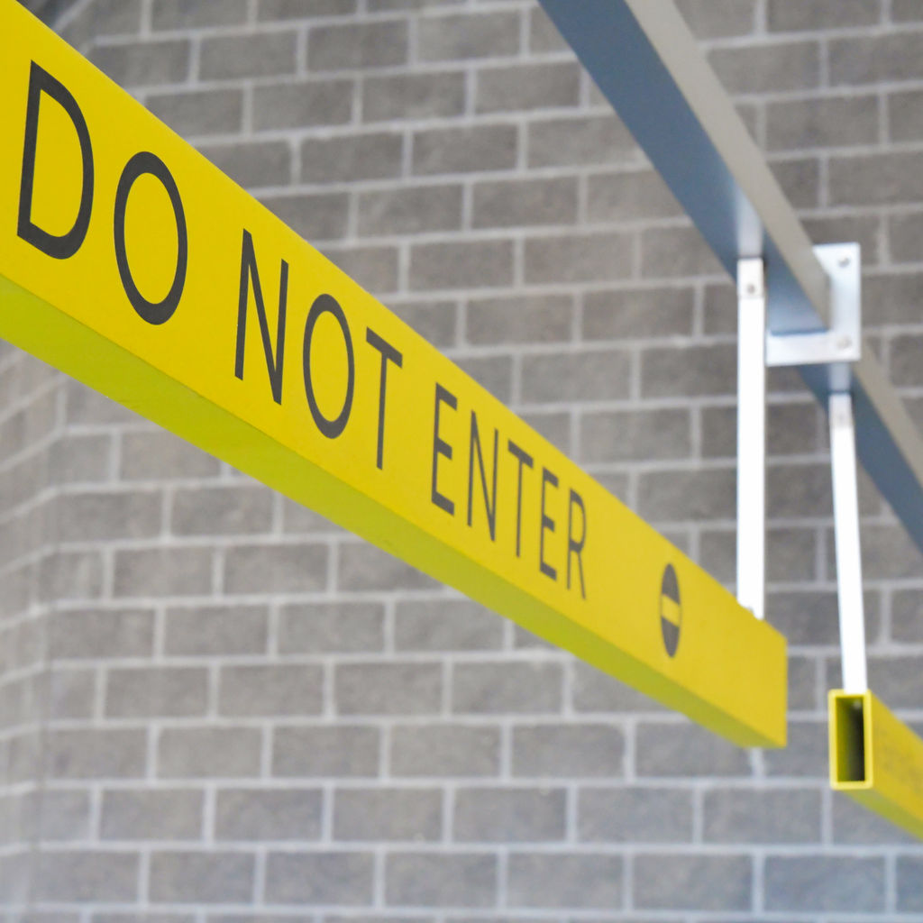 Rugged structure of an overhead parking garage sign.