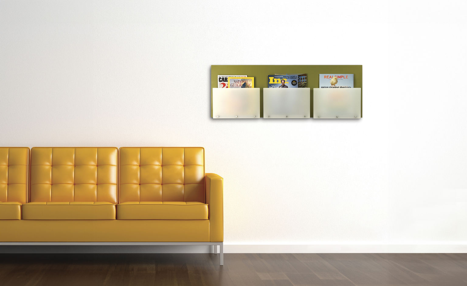 A waiting area with a yellow leather couch and a custom wall organizer holding magazines.