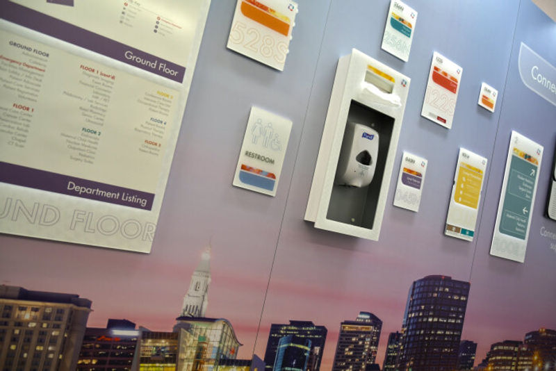 Custom Vivid, interior ADA signage with discreet changeable paper inserts and Purify unit. 