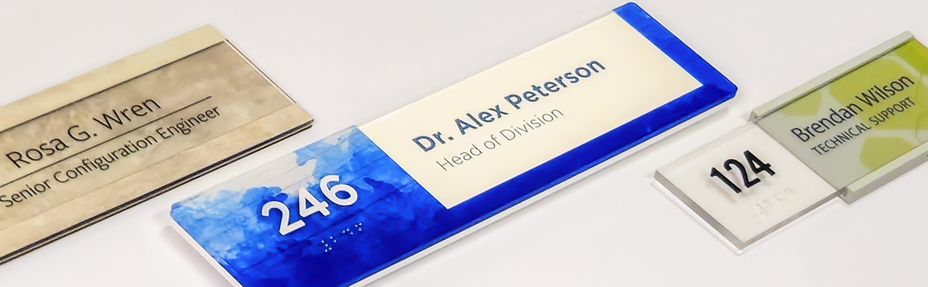 A Fusion, Vivid and Vivid workstation nameplate standing upright on a white background.