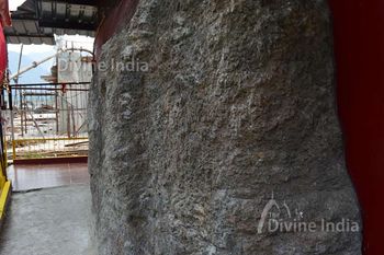 inside rock and backside of dhari devi idol