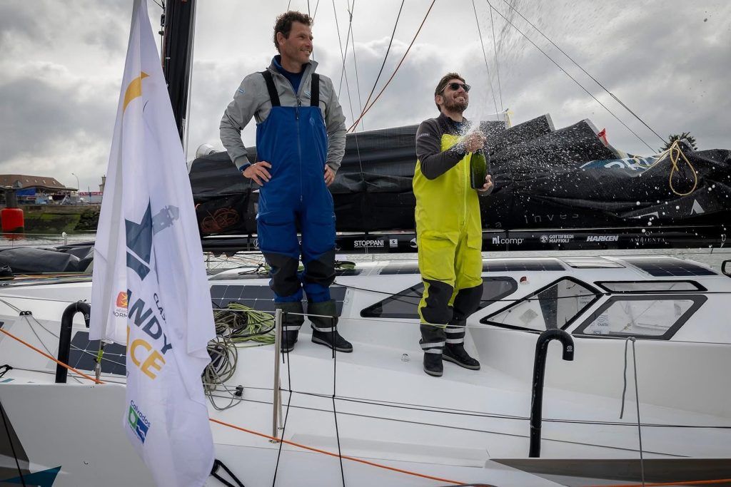 Luca Rosetti and Pierre Brasseur celebrating third place on the podium at the CIC Normandy Channel Race