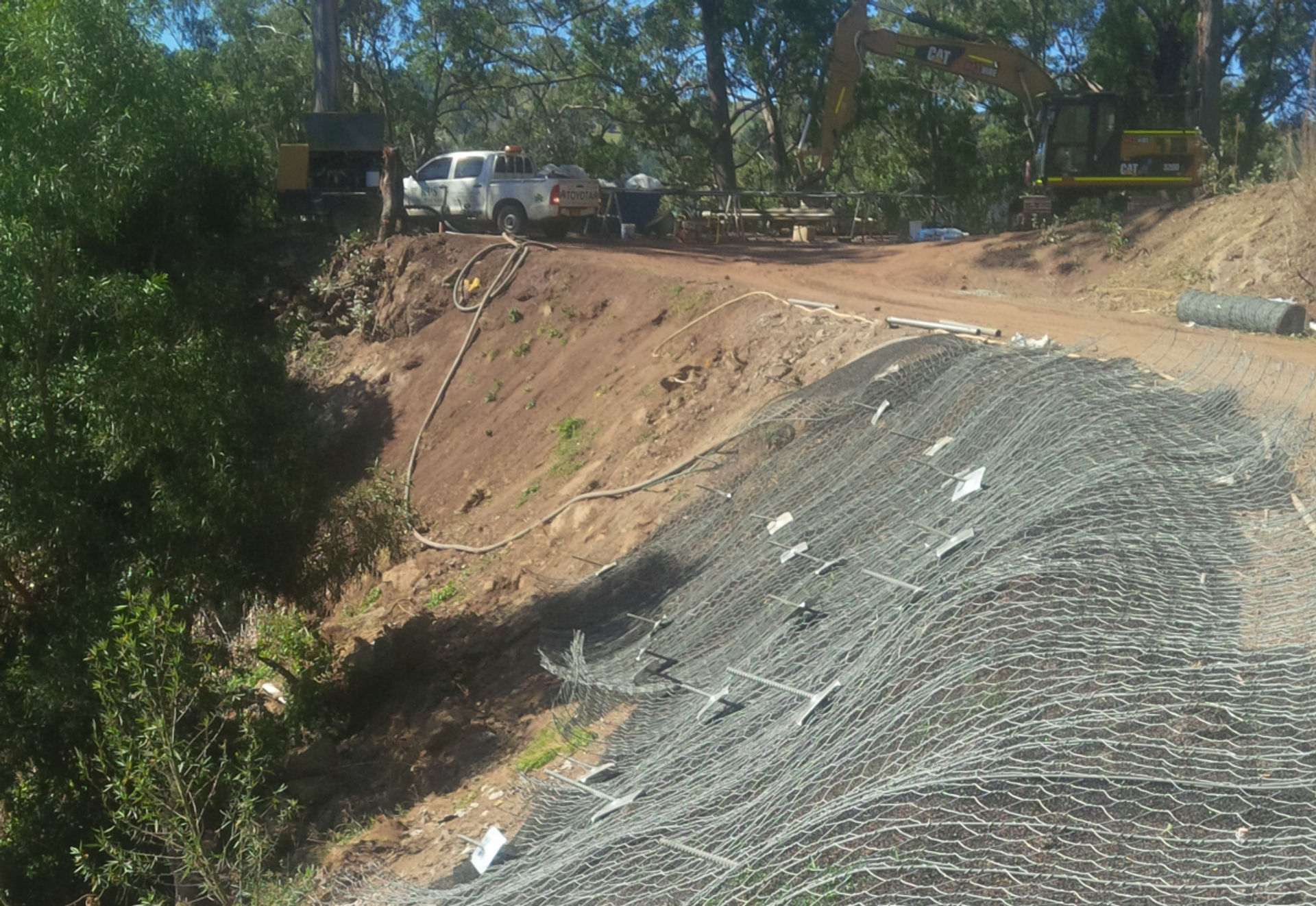 SLOPE STRENGTHENING WORKS ALONG TOM'S CREEK ROAD