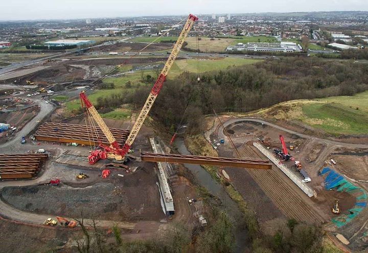 The North Calder bridge beam is lifted into place
