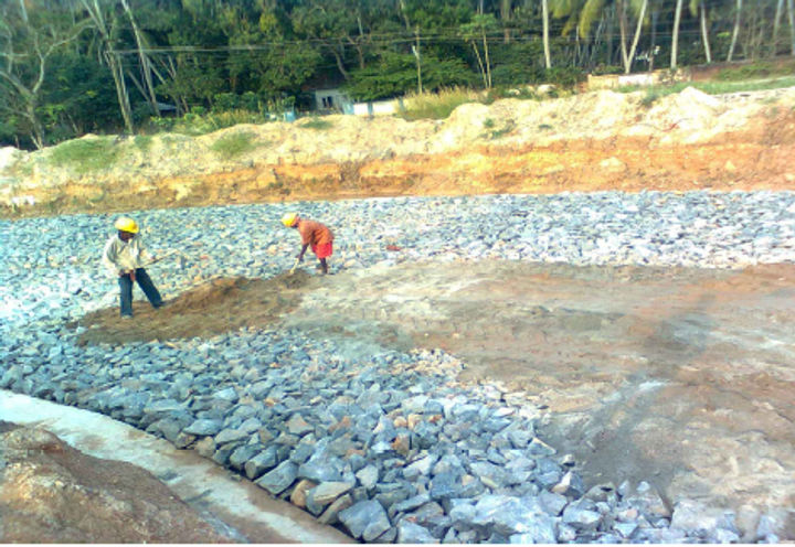 Photo 3: Laying of boulders at foundation levels on top