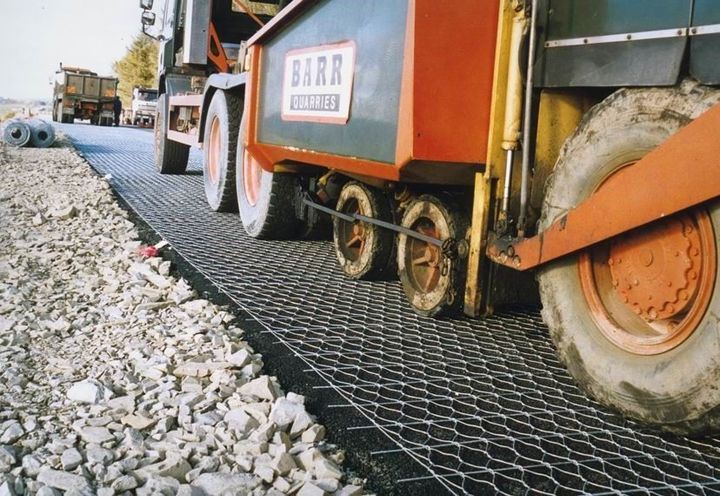 Close-up view of paving machine receiving asphalt