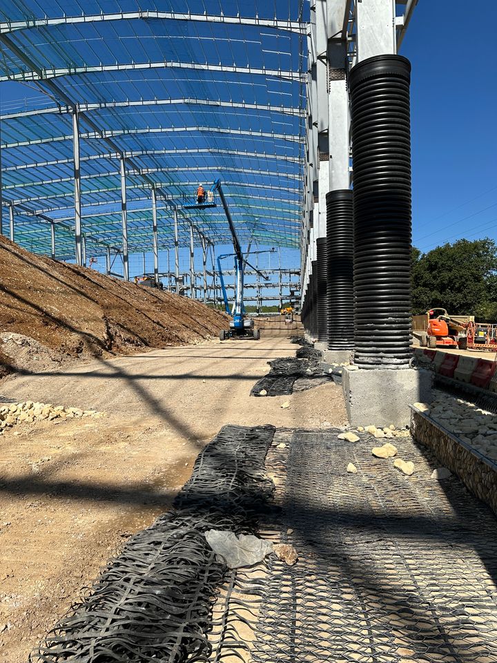 Terramesh units with ParaGrid geogrids  reinforcement being installed