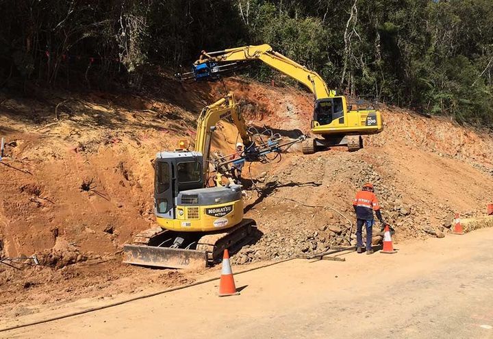 Upslope soil nail installation in progress