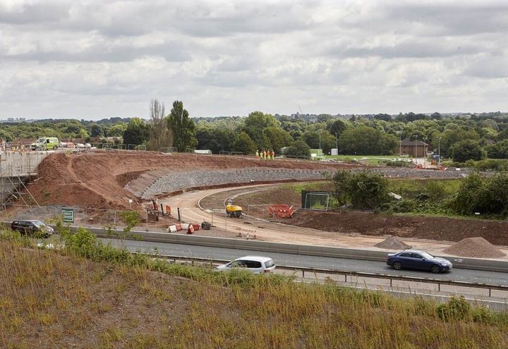 MacWall construction with reinforced soil support