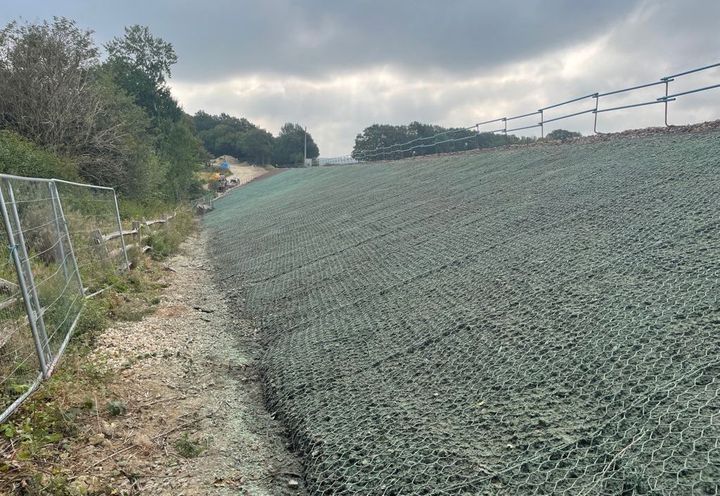 Anti-burrowing DT Mesh spread across rail embankment
