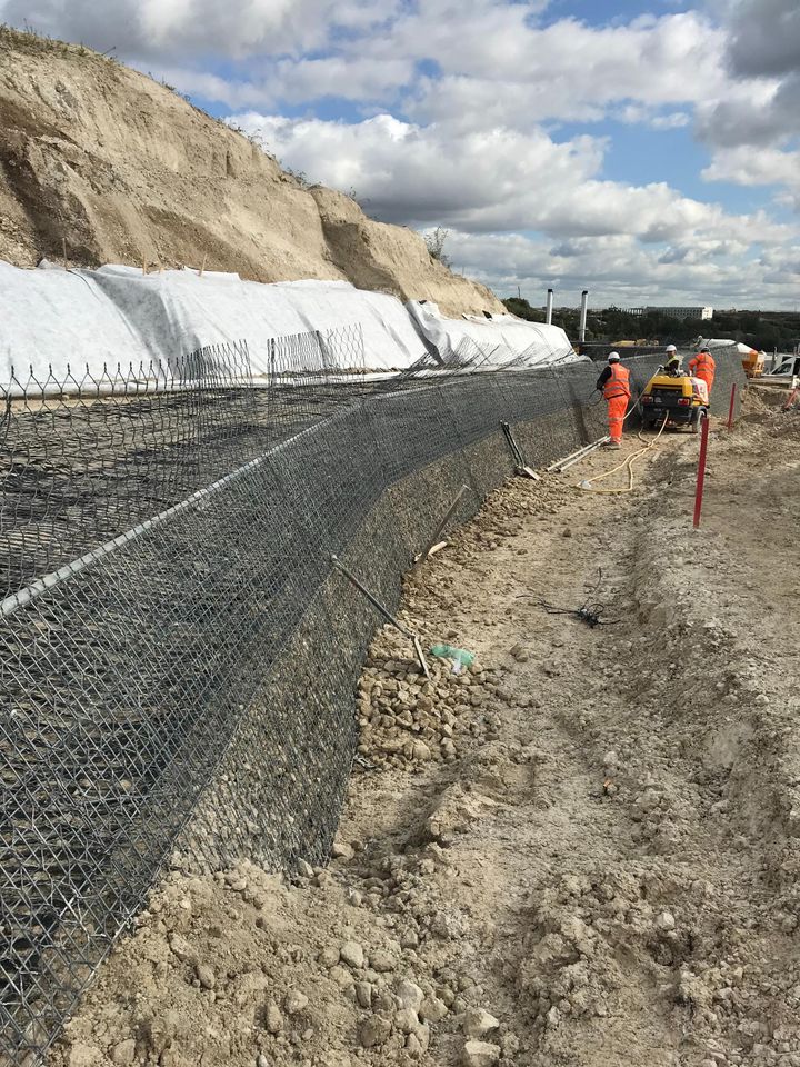 Mineral Terramesh units being erected – Note  MacDrain to rear