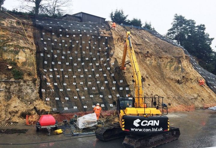 Preparing the netting along the rock face