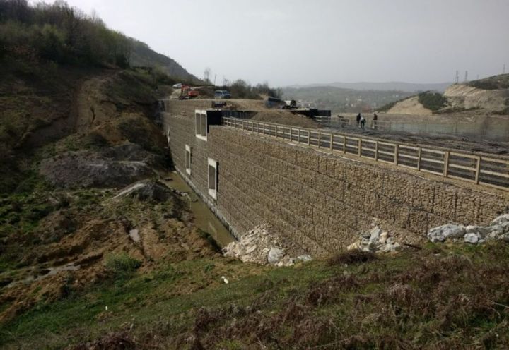 Geosynthetic supported berm