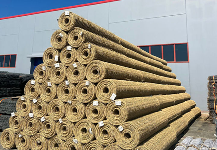 Beige coloured Polimac coated rockfall protection netting used in the project