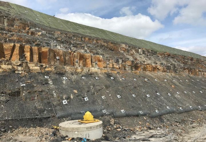 Steelgrid HR system secured to the rock face with plates