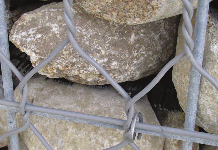 MacGrid® reinforcement is shown between the rocks which were used as filler in t