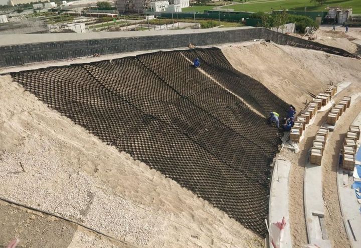 During construction: Laying of MacWeb geocell on inner gentle slope 
