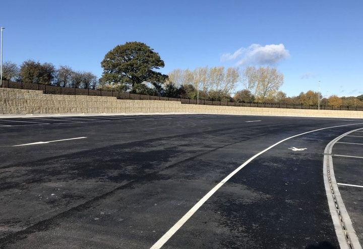 Terramesh® wall runs to edge of parking area and steps down