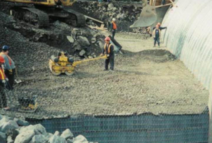 Compacting structural backfill onto the Terrawall® units