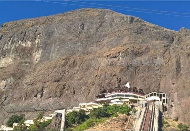 Completed scope of two lines of rockfall barriers and secured drapery system