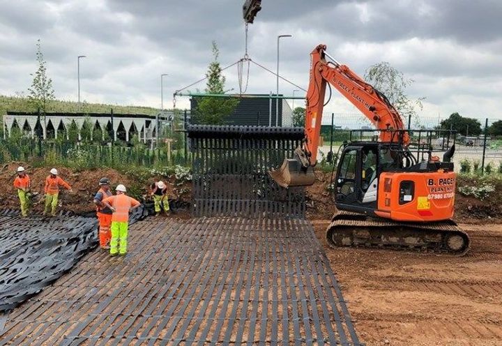 Transverse layer of ParaLink® being installed with a spreader bar.